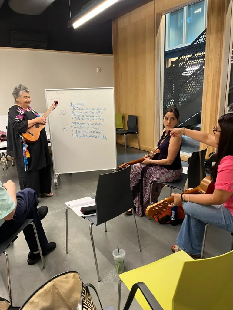 Jarana workshop at The Foundry: the teacher explains verses on a whiteboard